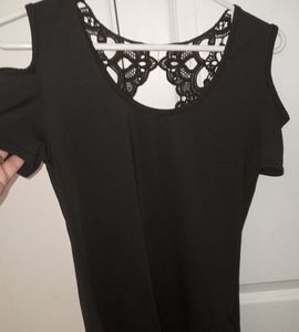 Women's black SM.short-sleeved Shirt with an open design in the back.